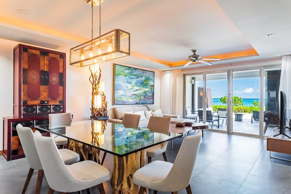 Modern dining room with ocean view at a Buena Vida Homes property
