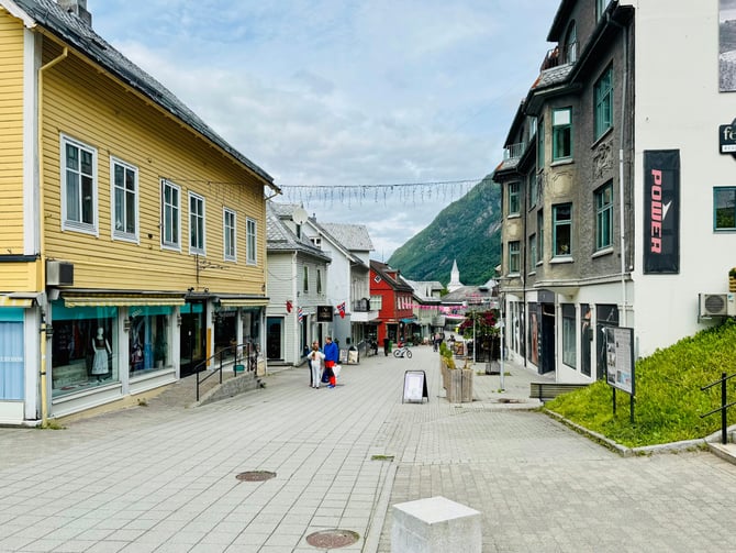 Open-air pedestrian shopping street with storefronts