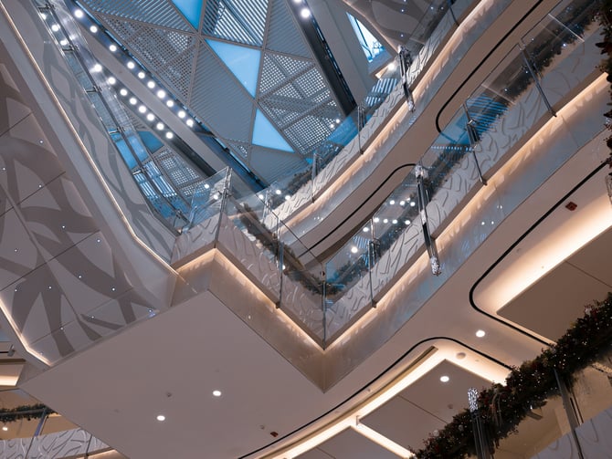 Modern multi-level mall interior with angular architecture