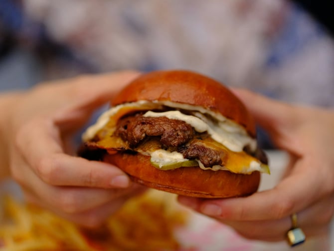 Smash burger with melted cheese on a brioche bun