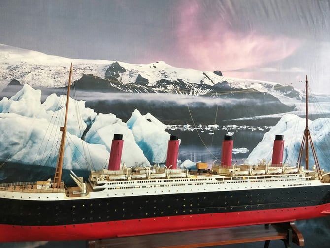 Titanic scale model with iceberg backdrop