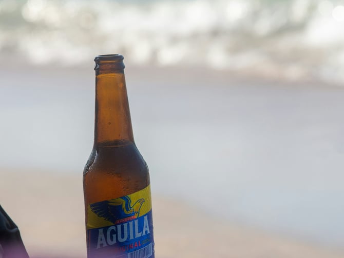 Cold beer and aguachile at a casual Mexican seafood spot