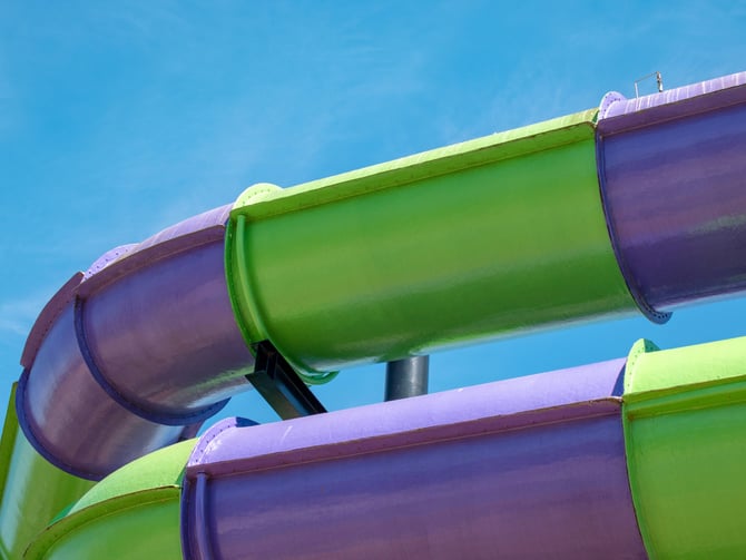 Colorful water slides against a bright blue sky